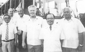 On April 18, 1984, Commonwealth Motors, a division of Jones & Guerrero Co., was selected by Hino Motors Ltd. of Japan to distribute buses and heavy equipment in Micronesia. At the reception at the Guam Hilton were (from left) ShoichiNagura, managing director, Hino Auto Body Ltd.; Lee Holmes, president of Guam Cable TV; R.T. “Twick” Grant, first general manager of Triple J Motors; Robert H. Jones, executive vice president of Jones & Guerrero; Tsunenori Yamauchi, general manager of Hino Motors overseas marketing division; and Kenneth T. Jones Jr., president of Jones & Guerrero.