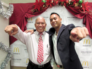 Ayuyu with his son, Joe E. Ayuyu, manager of McDonald's of Saipan, in 2015.